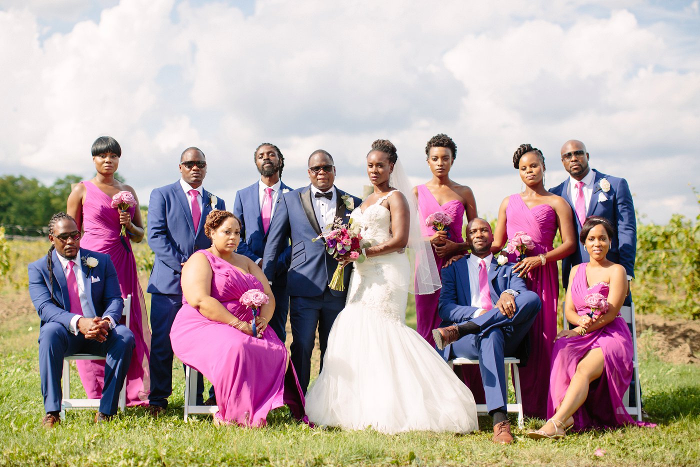 bridal party wearing navy blue and purple dresses