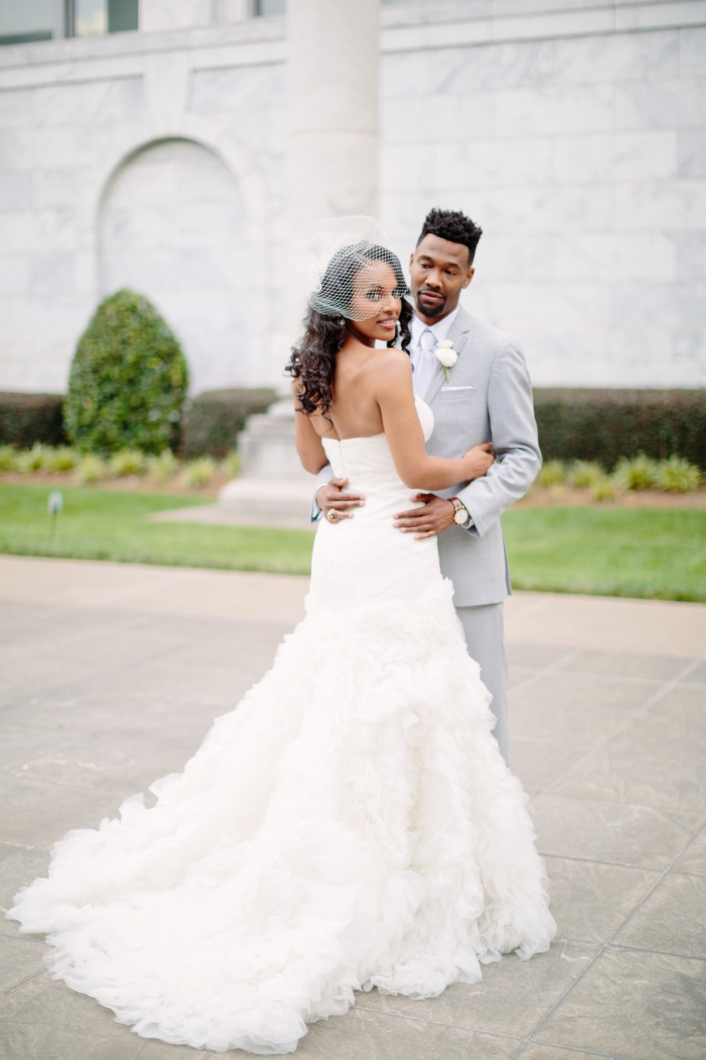  Wedding couple embracing outdoors 