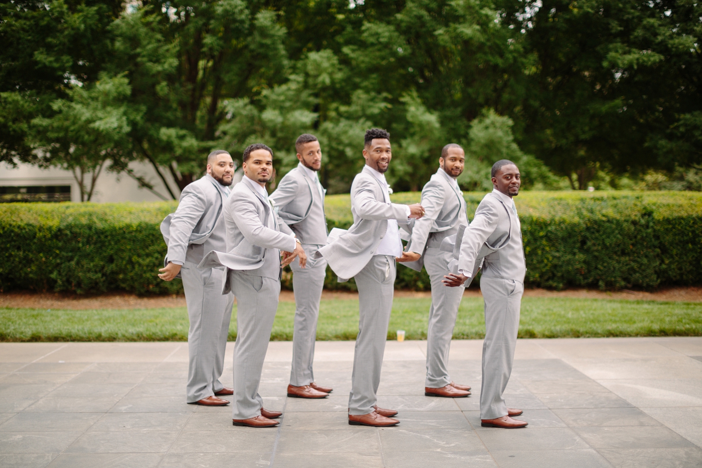 black atlanta groomsmen in light grey suits