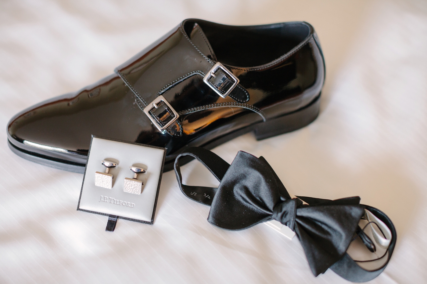 groom's details black bow tie and cufflinks