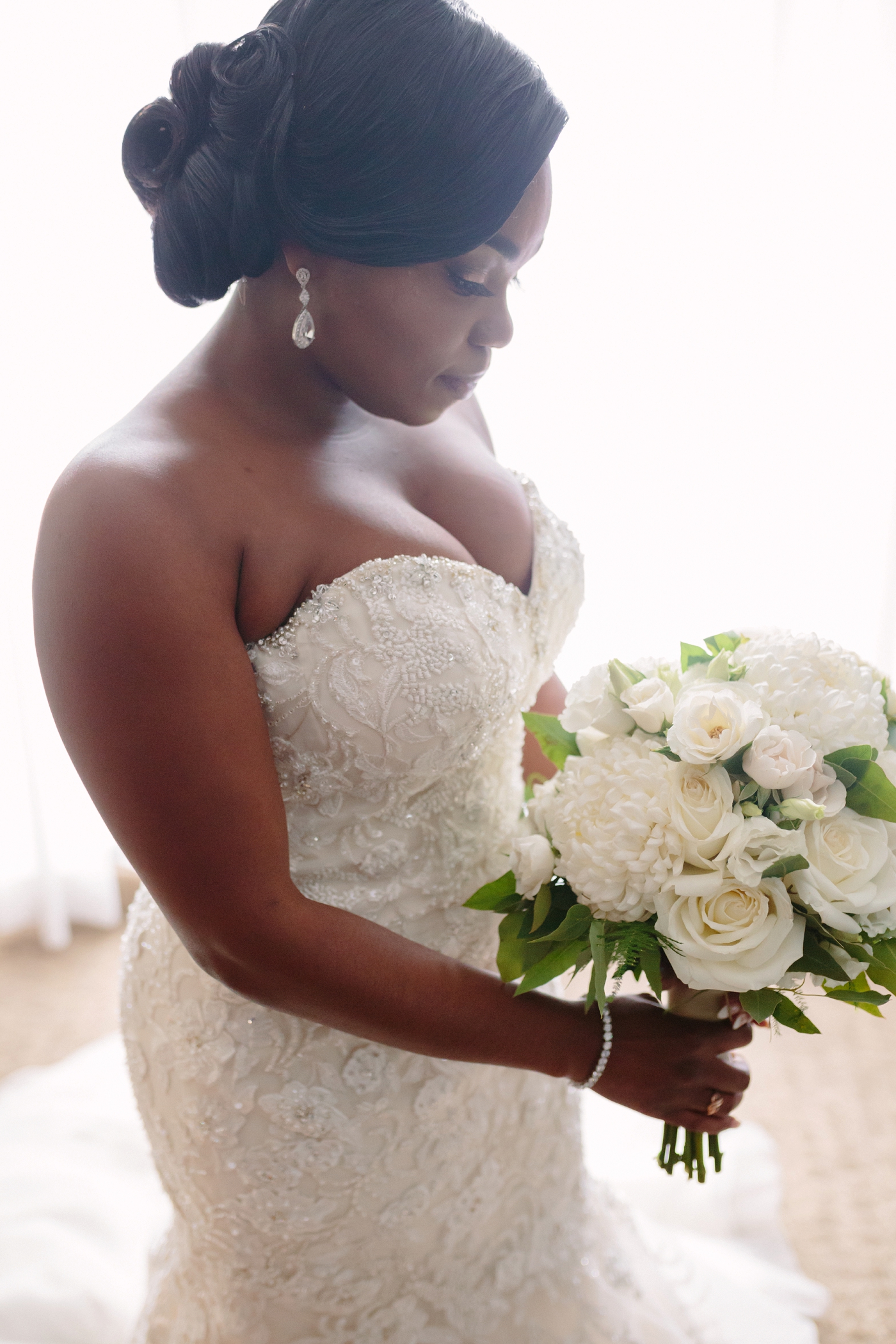 classic bridal fashion with updo white rose bouquet