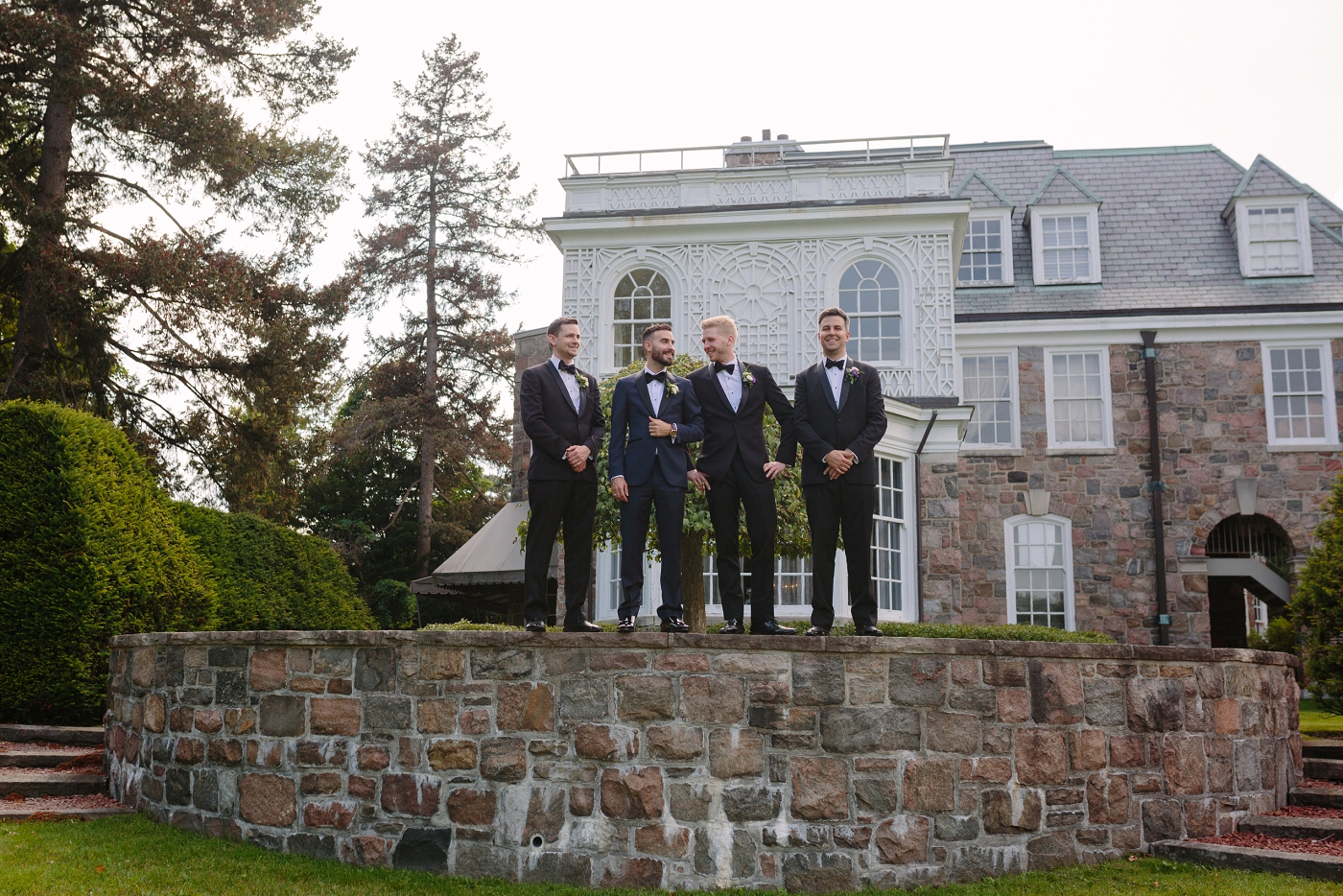 groomsmen outside of the McLean House at the Estate of Sunnybrook