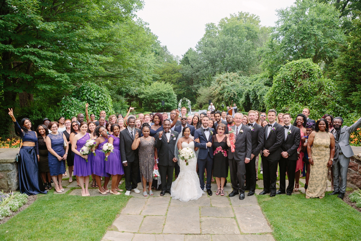 multi racial and cross cultural wedding group photo