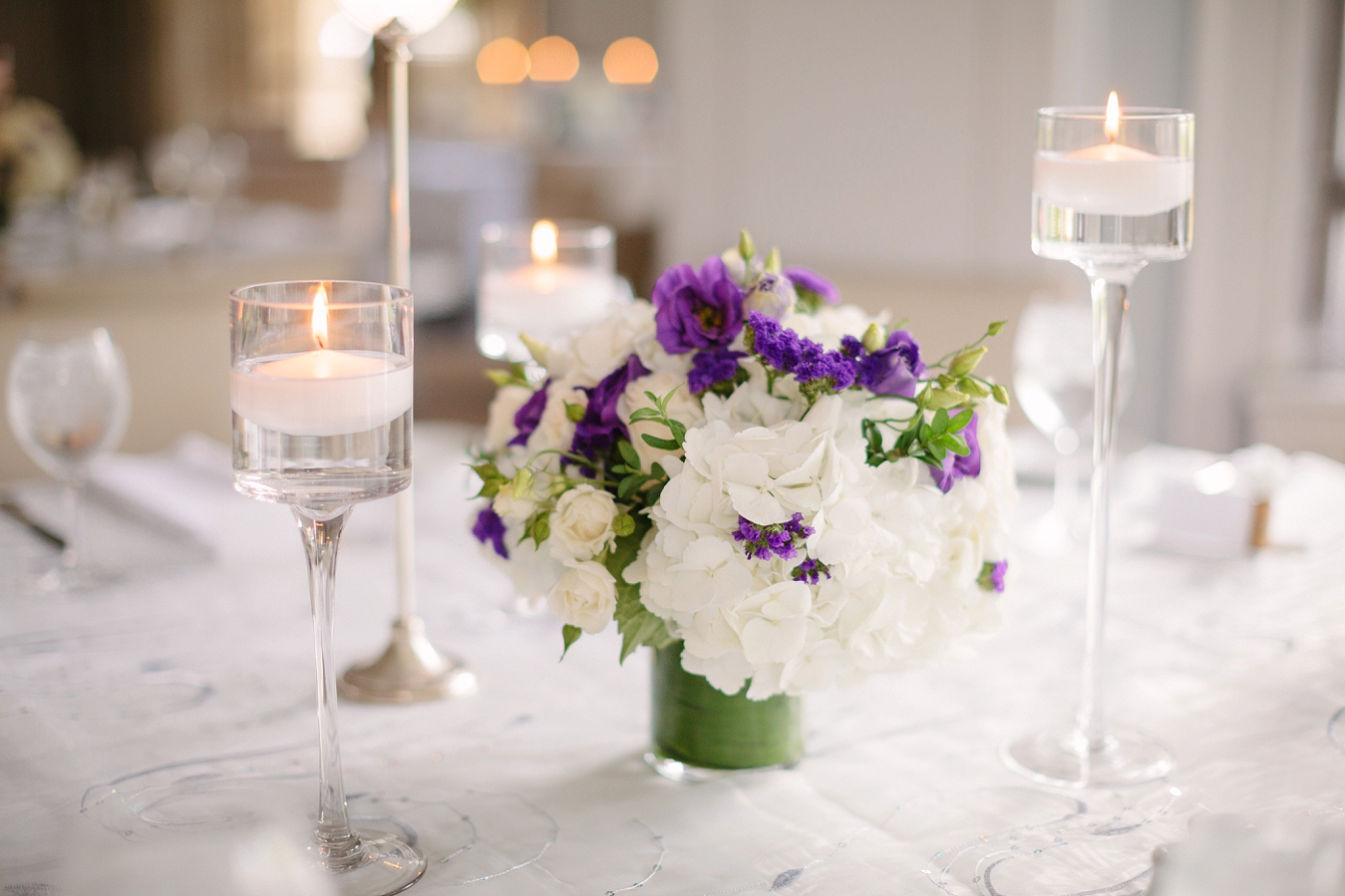 simple and elegant decor with purple and white centerpieces
