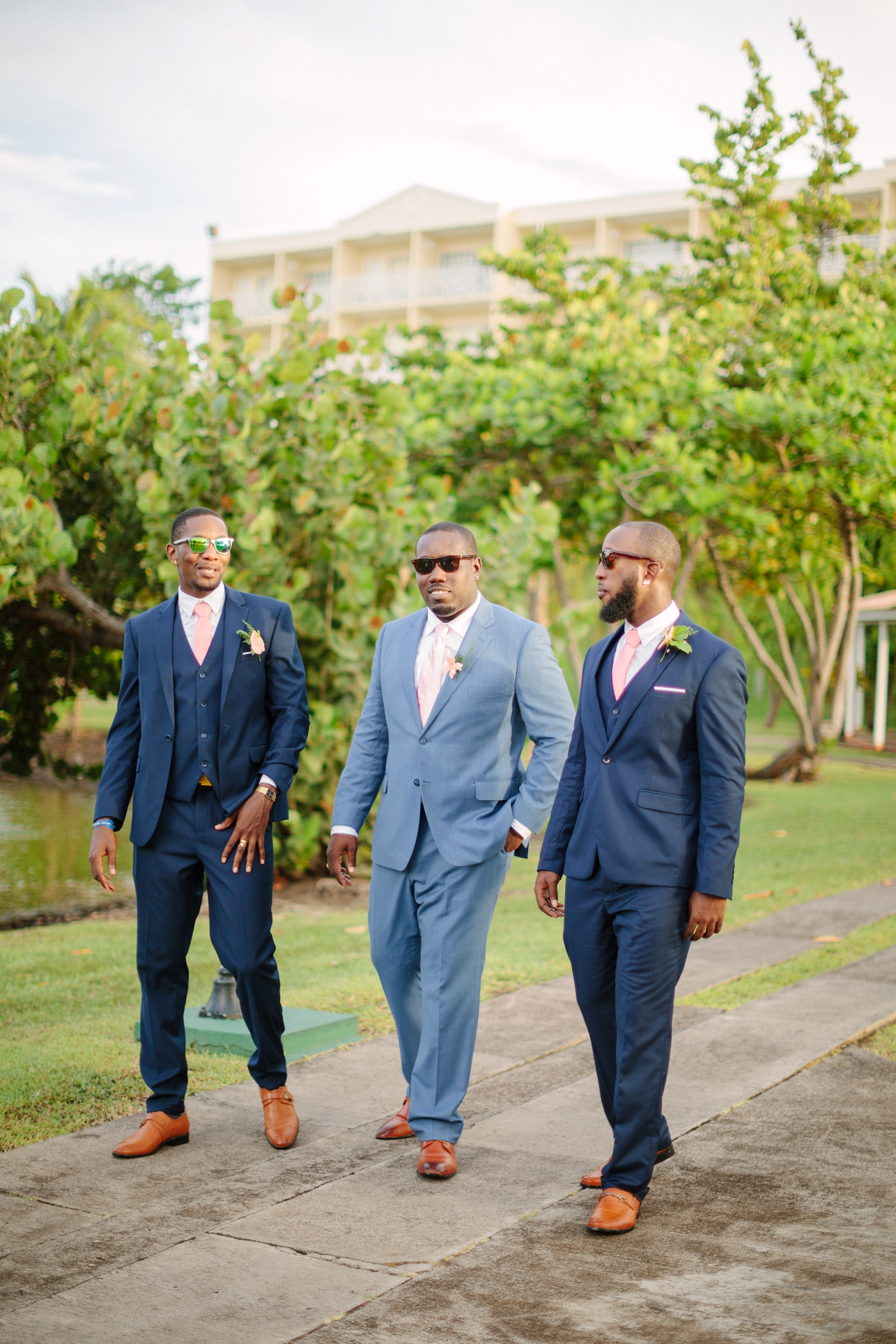 groomsmen and groom in navy blue suits at destination wedding