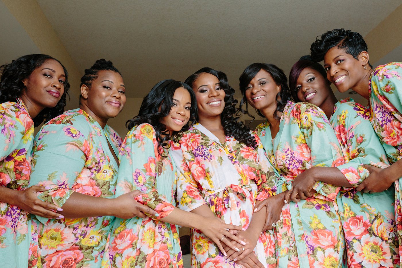 bridemaids wearing matching floral robes