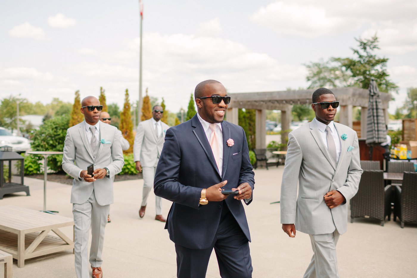 groom and groomsmen wearing sunglasses