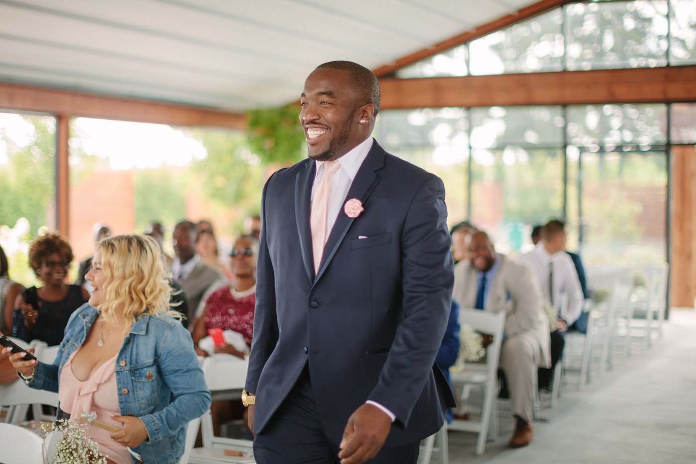groom smiling at wedding ceremony