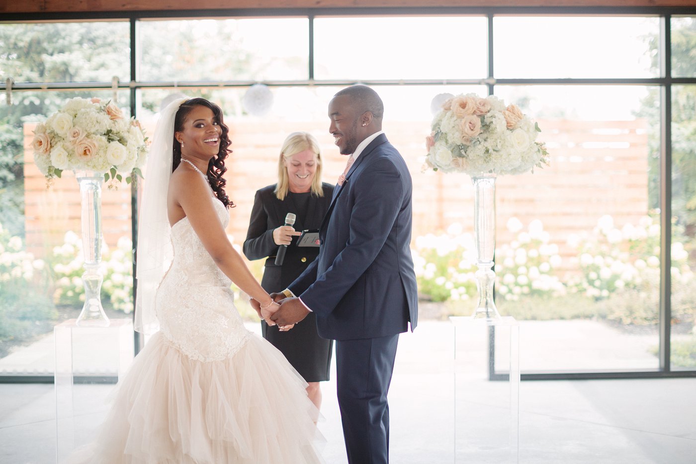 bride and groom laughing at wedding ceremony