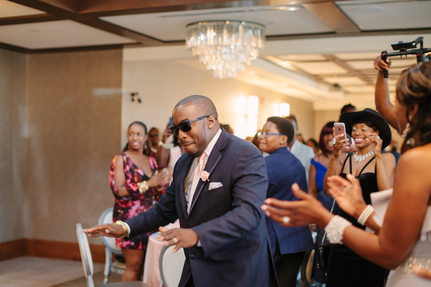 groom enters wedding reception dancing to drake