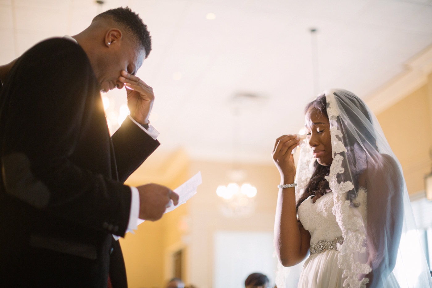 Emotional wedding ceremony moment.
