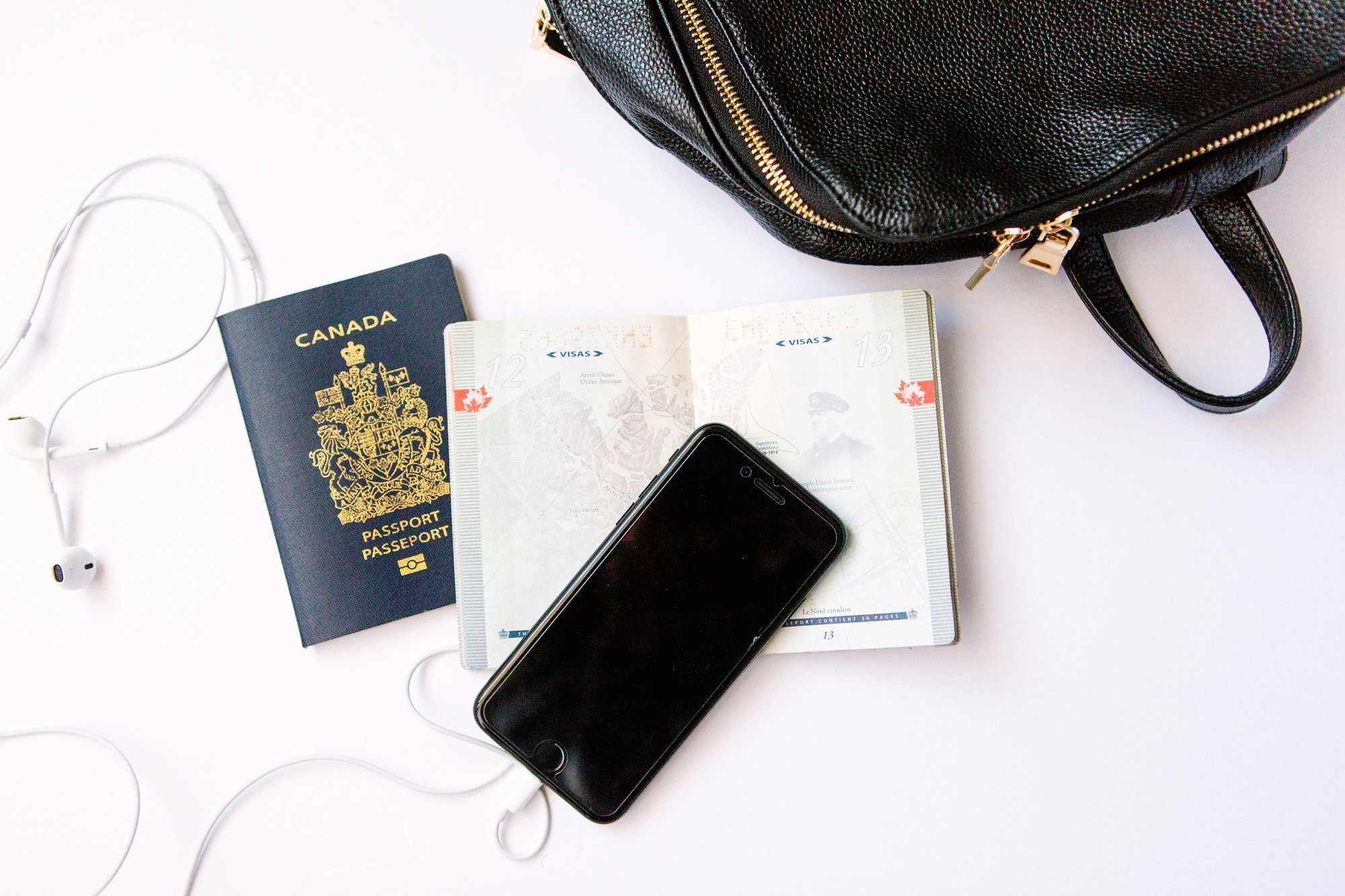 canadian passport flat lay photo