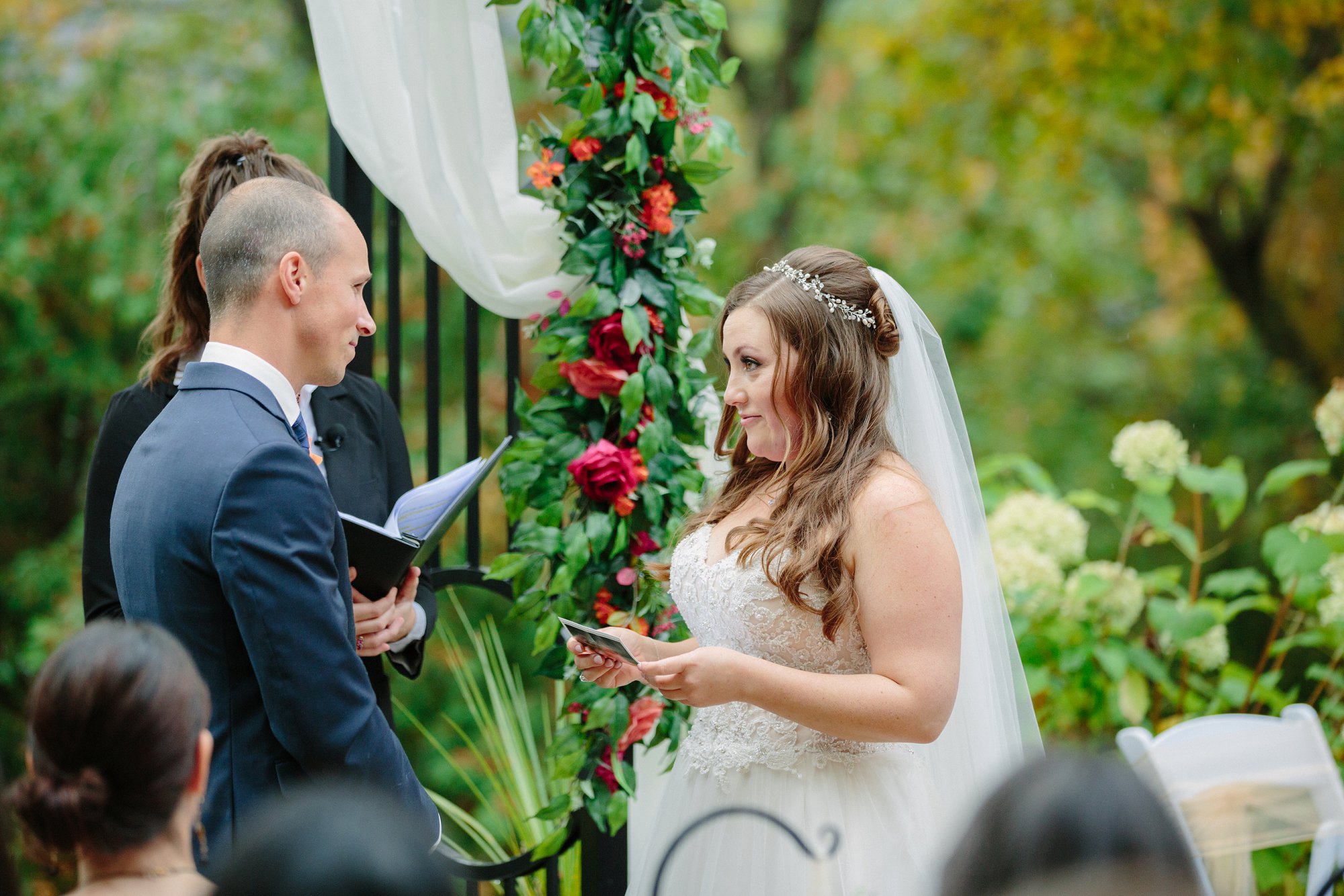vow exchange between bride and groom from outdoor wedding ceremony