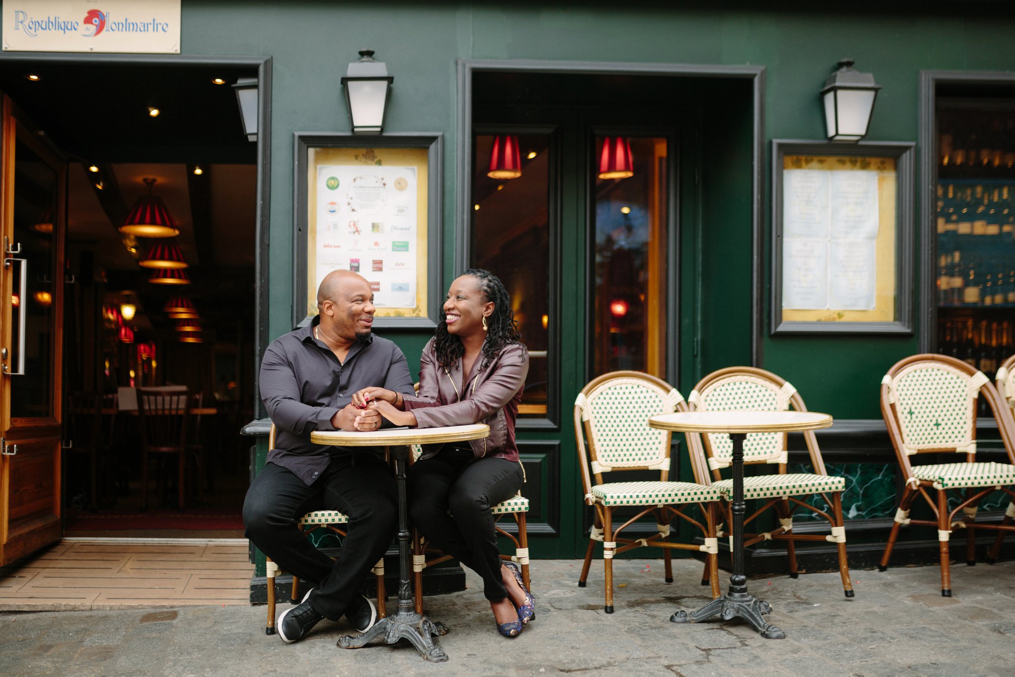 black love goals outside Paris coffee shop photos
