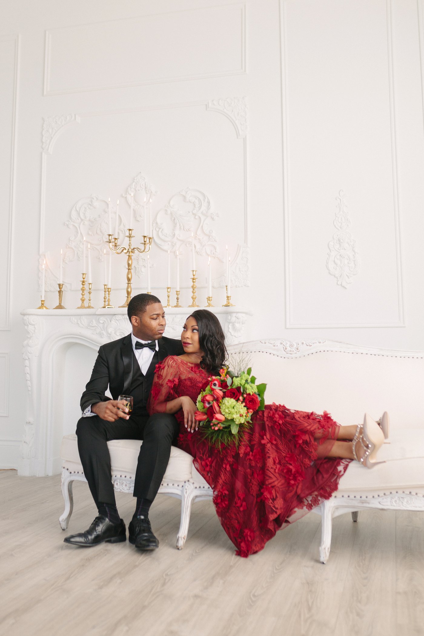 Long red dress and black suit engagement session outfit