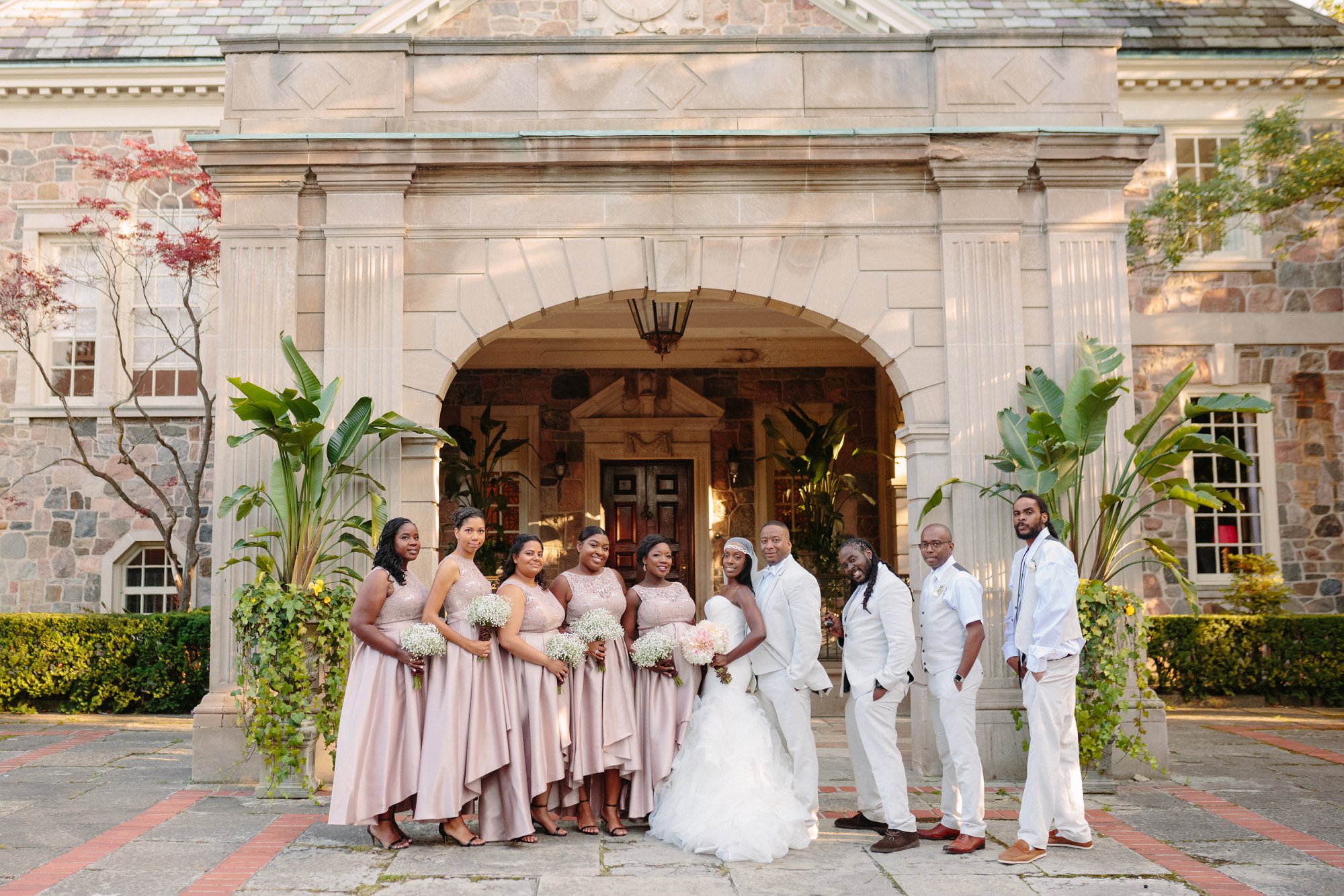 bridal party in summer wedding wearing white and gold
