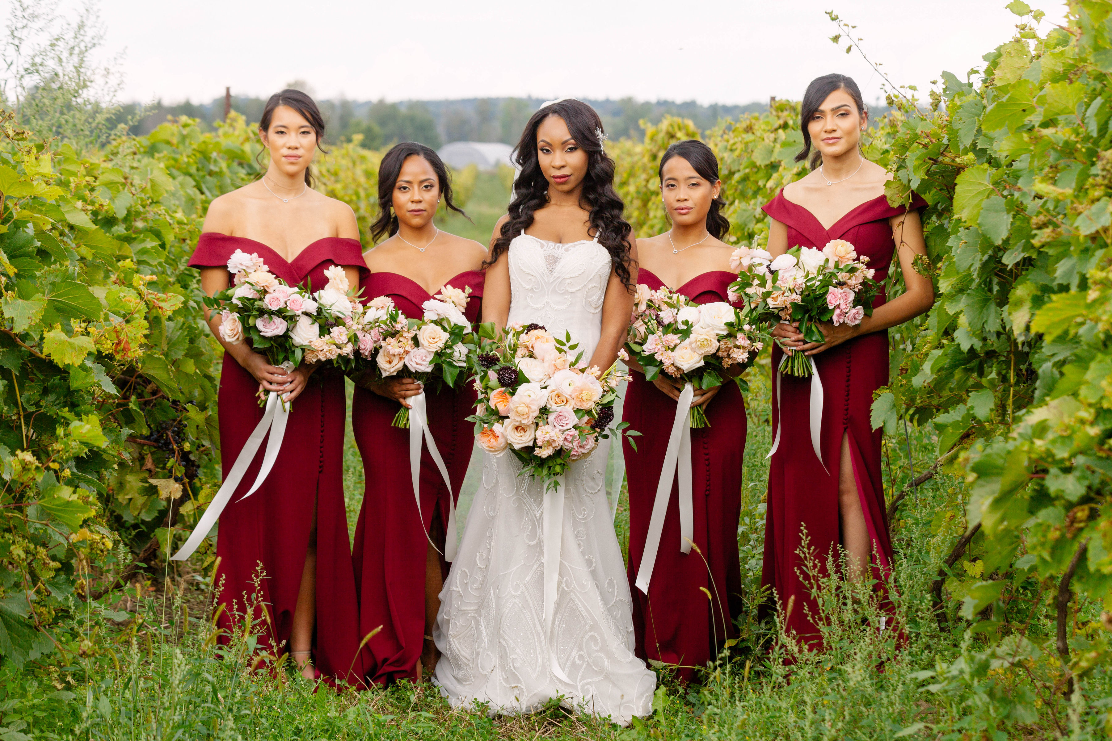 Bridesmaids in off shoulder red gowns at Willow springs winery in Markham ON