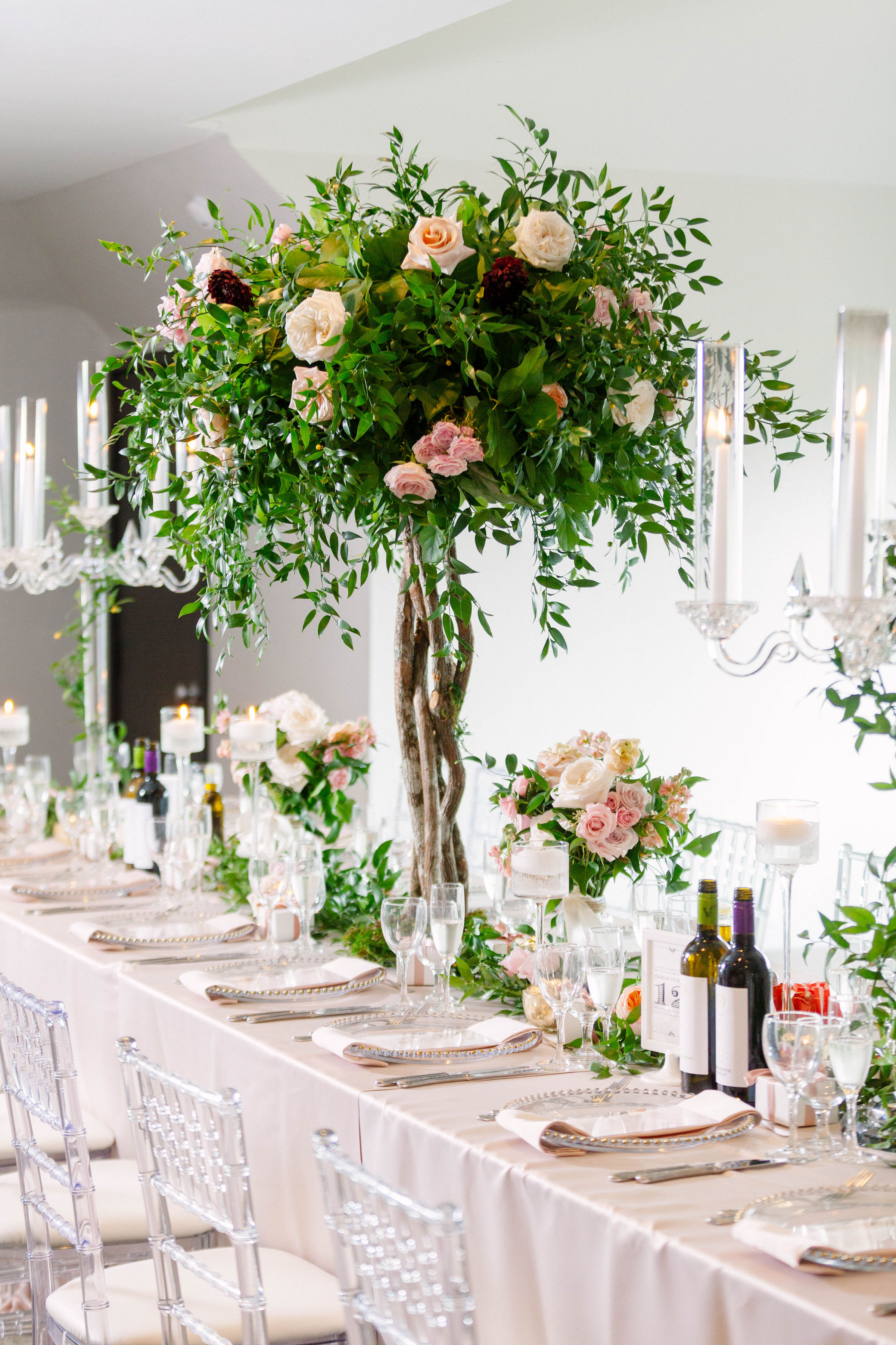 Wedding reception with tall floral centerpieces at The Manor by Peter and Paul's