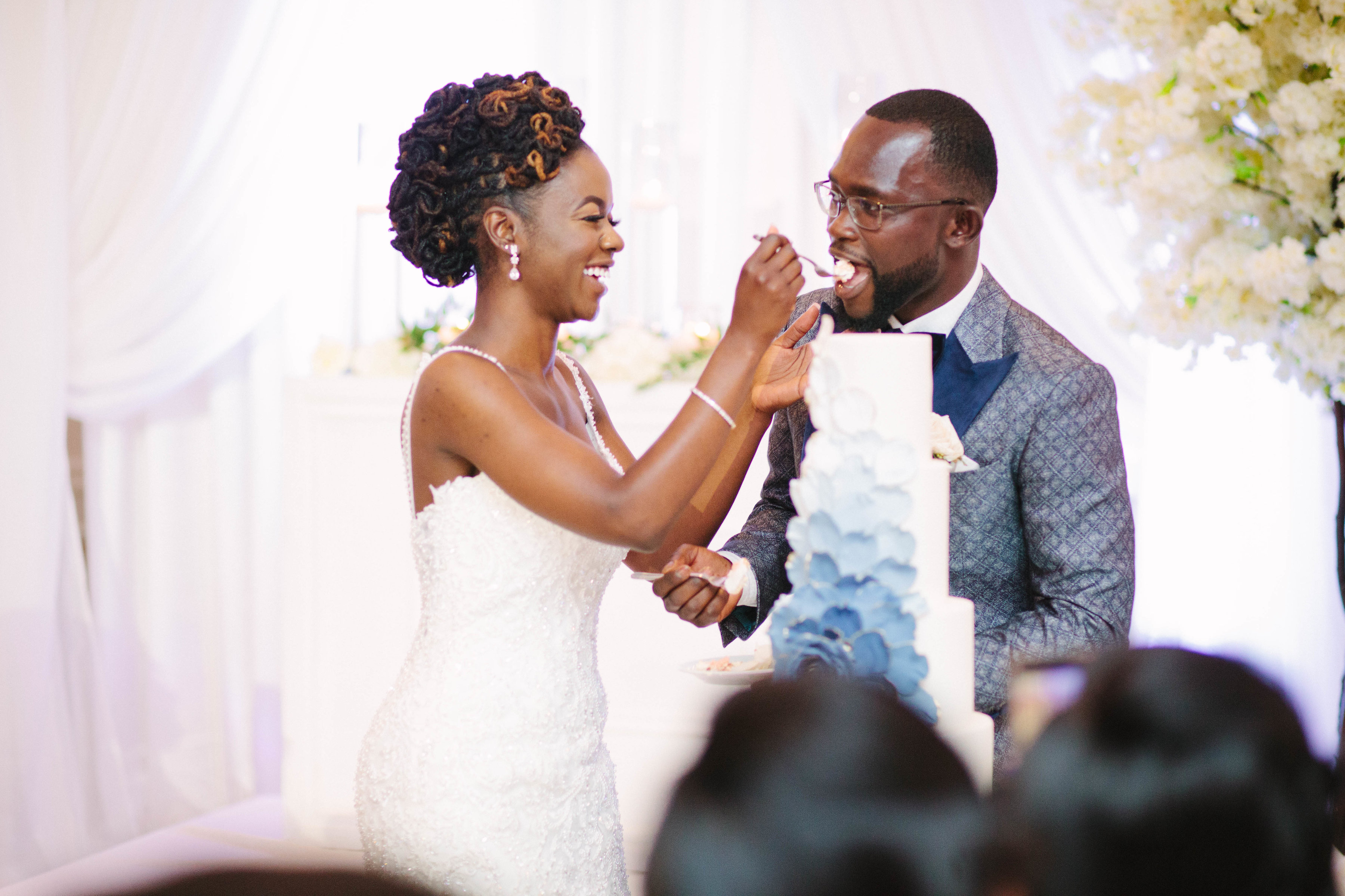 bride and groom eat cake