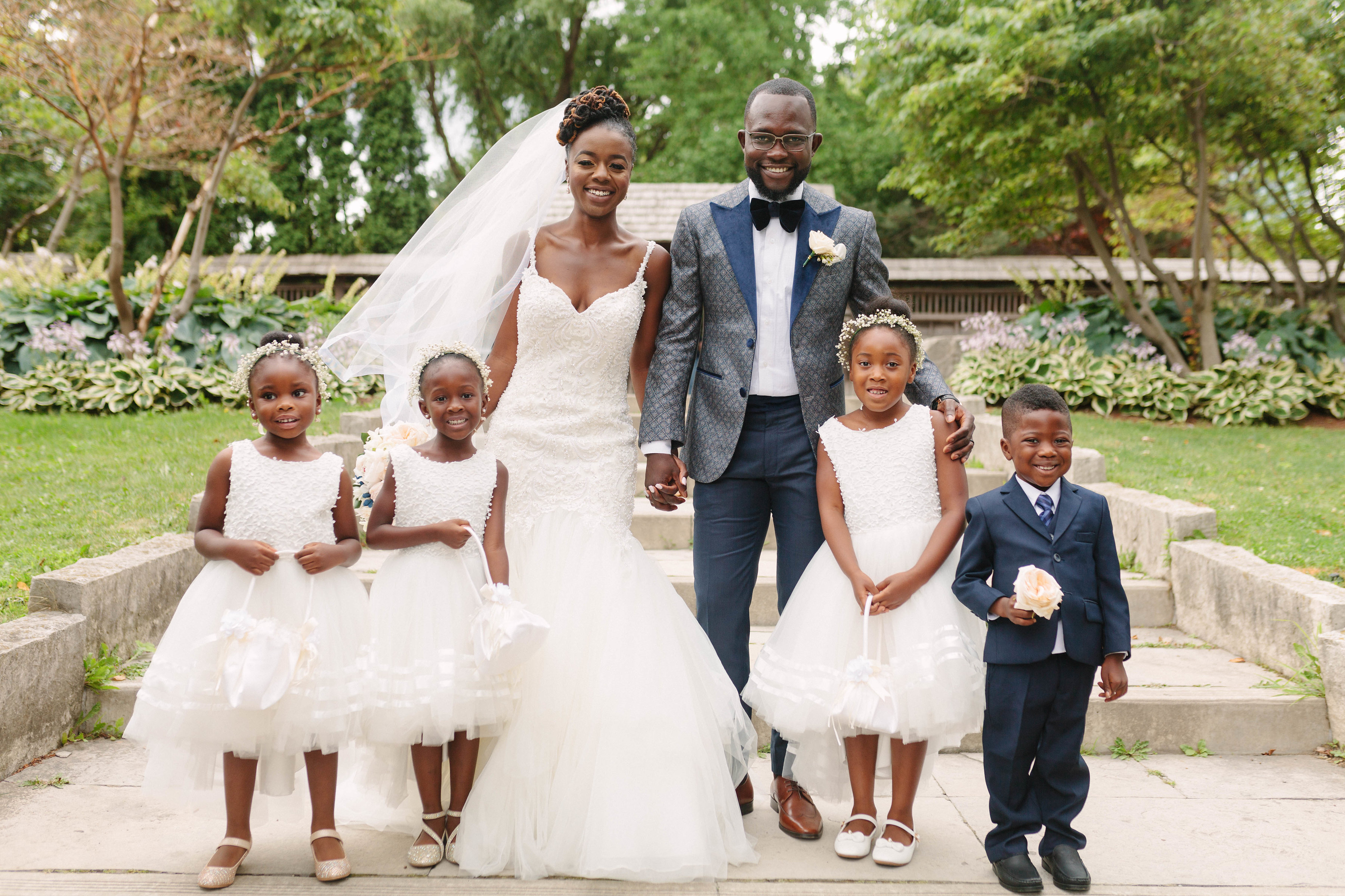 bride and groom with flower girls and ring bearer