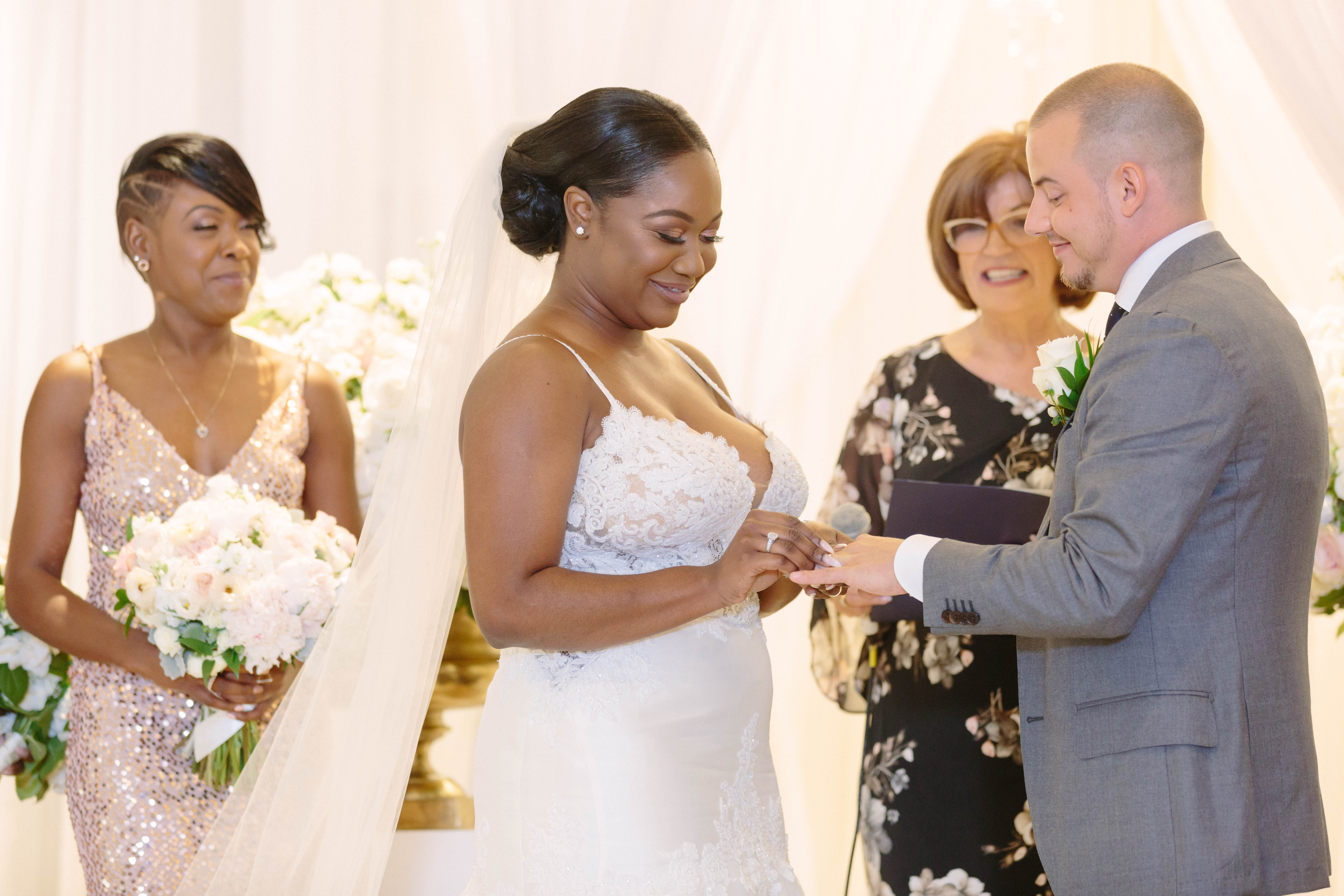 bride and groom exchange rings