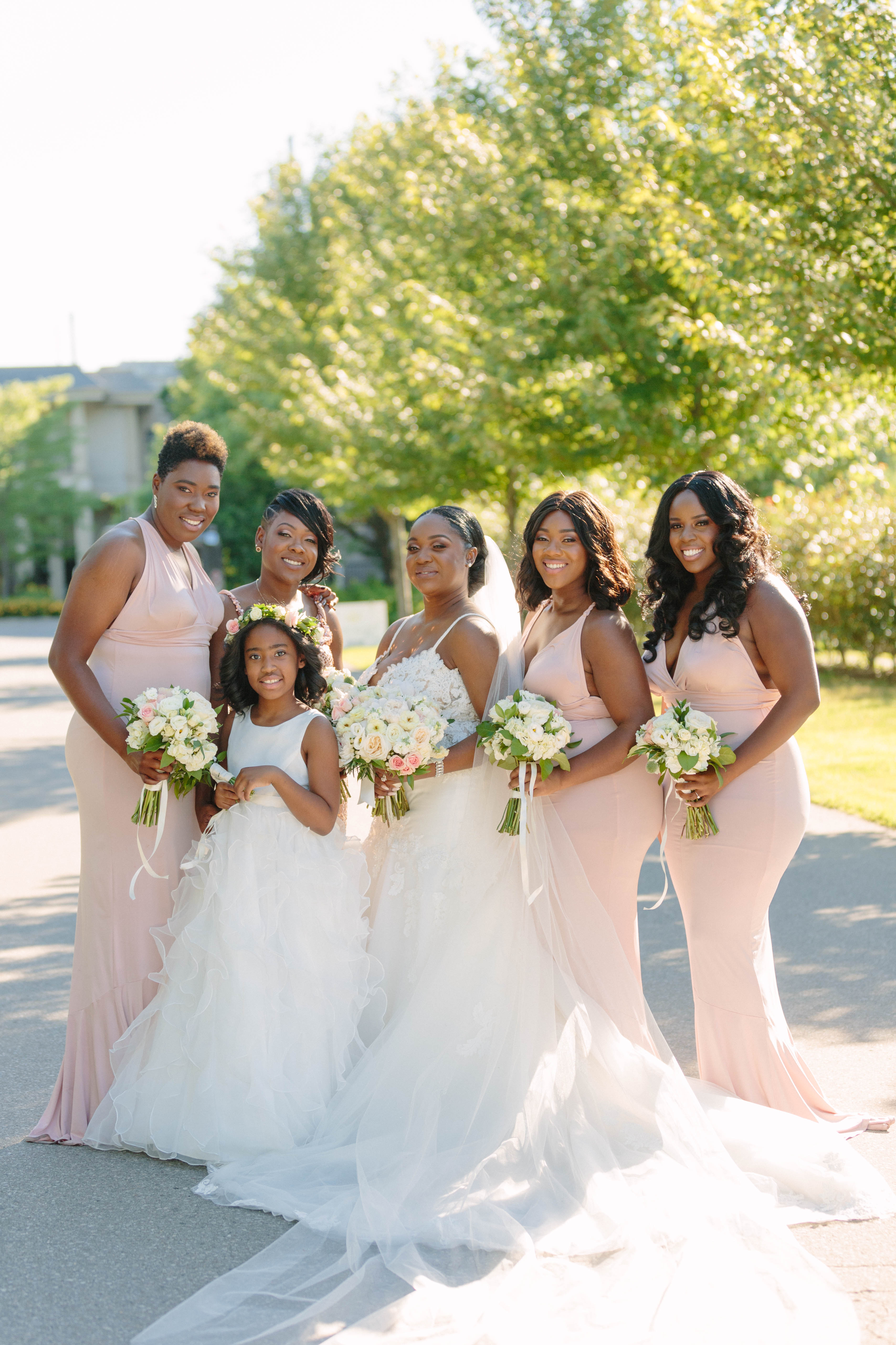 bride, flower girl and bridesmaids