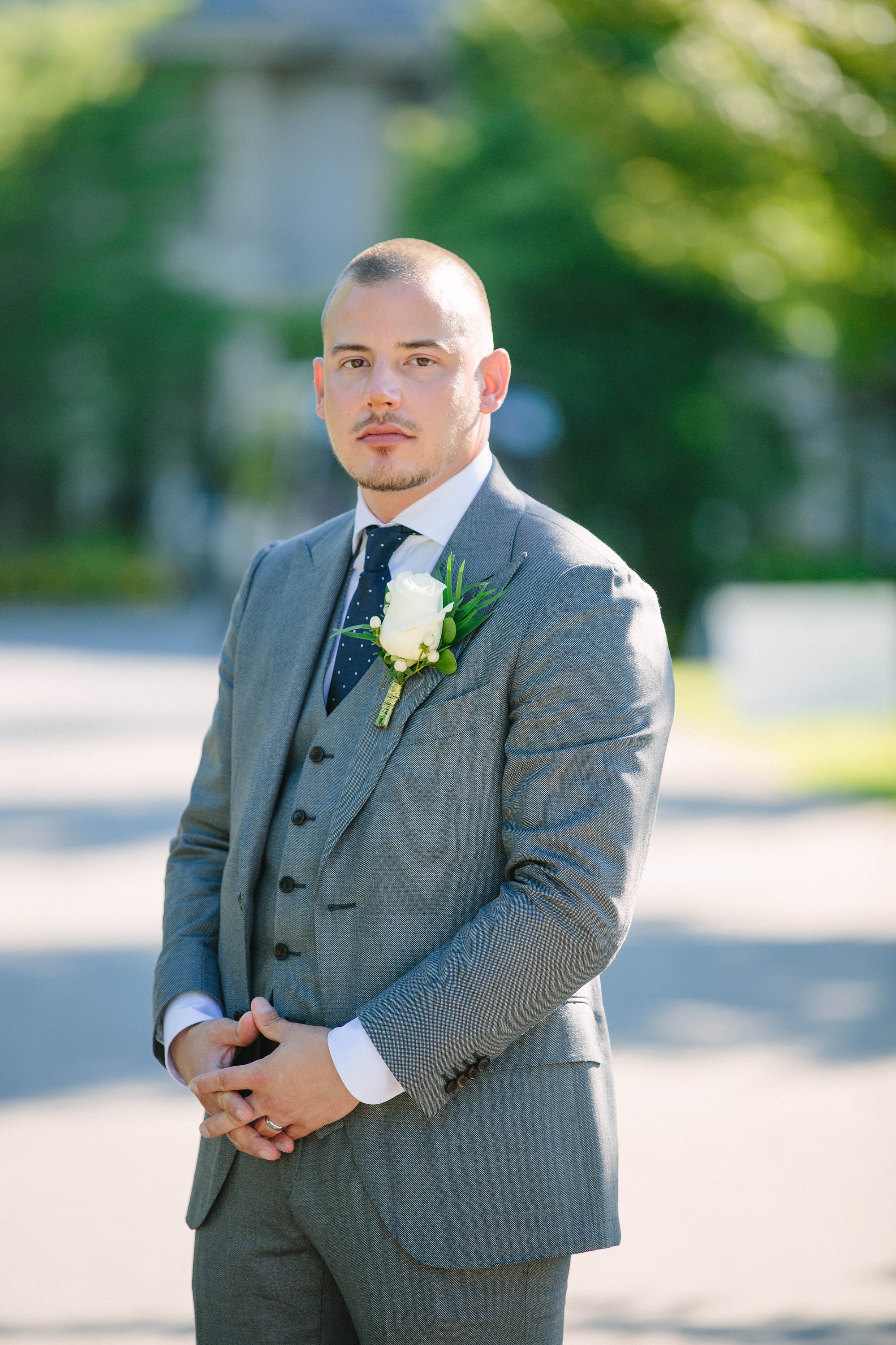 groom in grey suit