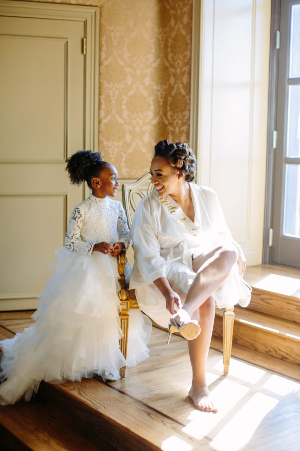 Bride and flower girl, Oheka Castle, New York.