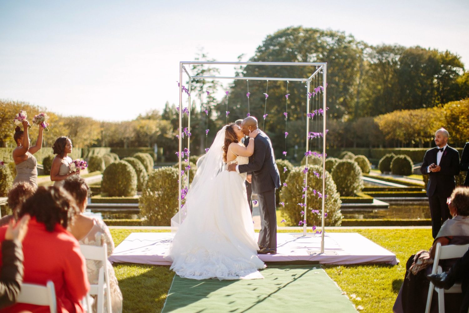 New York wedding photography, bride and groom kissing at alter.