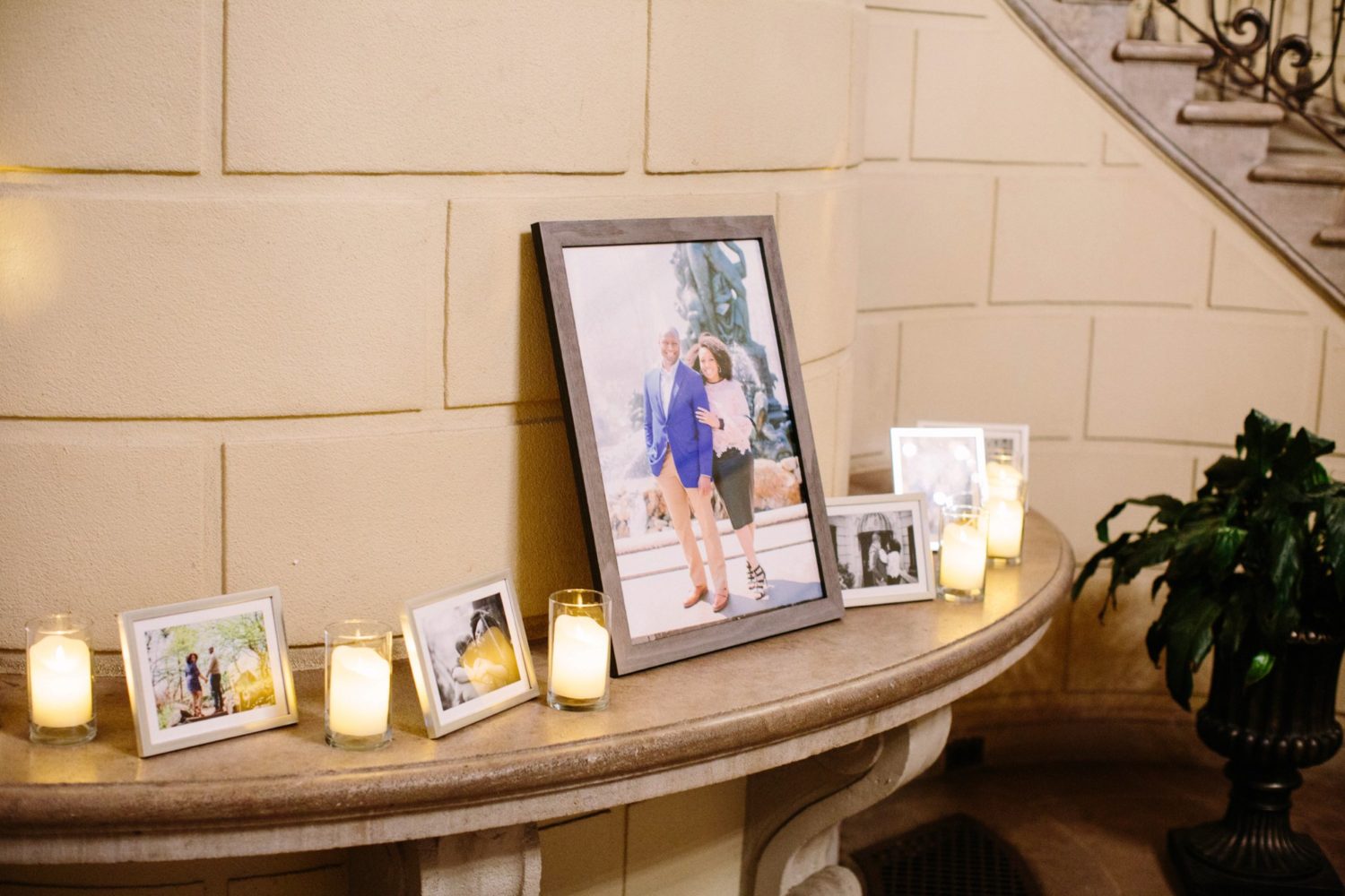 Close up of engagement photos displayed on mantle at Oheka Castle, New York.