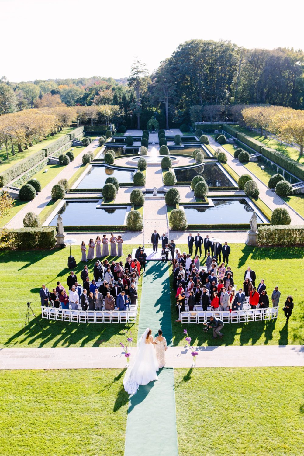 Arial shot of bride walking down isle at Oheka Castle, New York Photography.