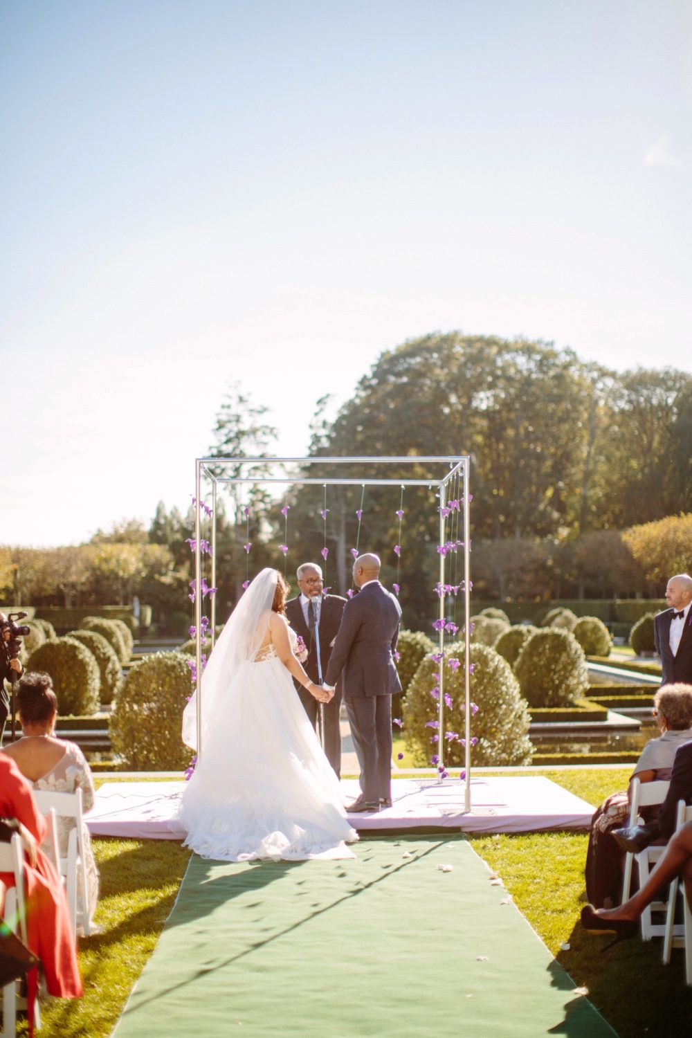 Bride and Groom standing at alter, Long Island wedding photography.