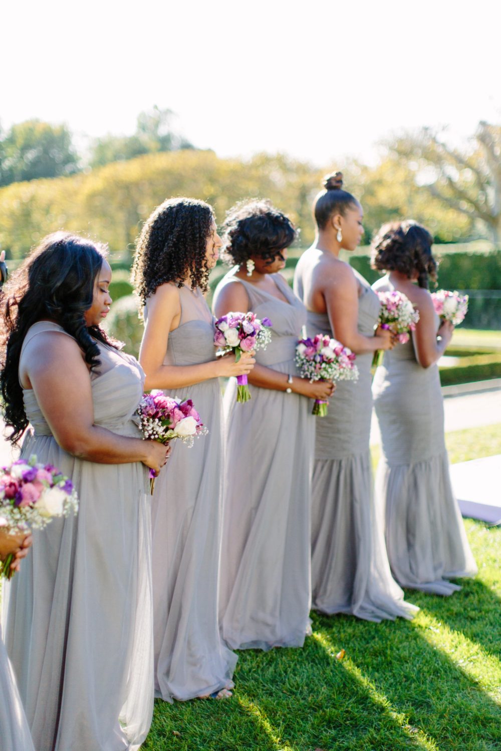 Wedding ceremony photography, bridesmaids in ceremony at Oheka Castle.