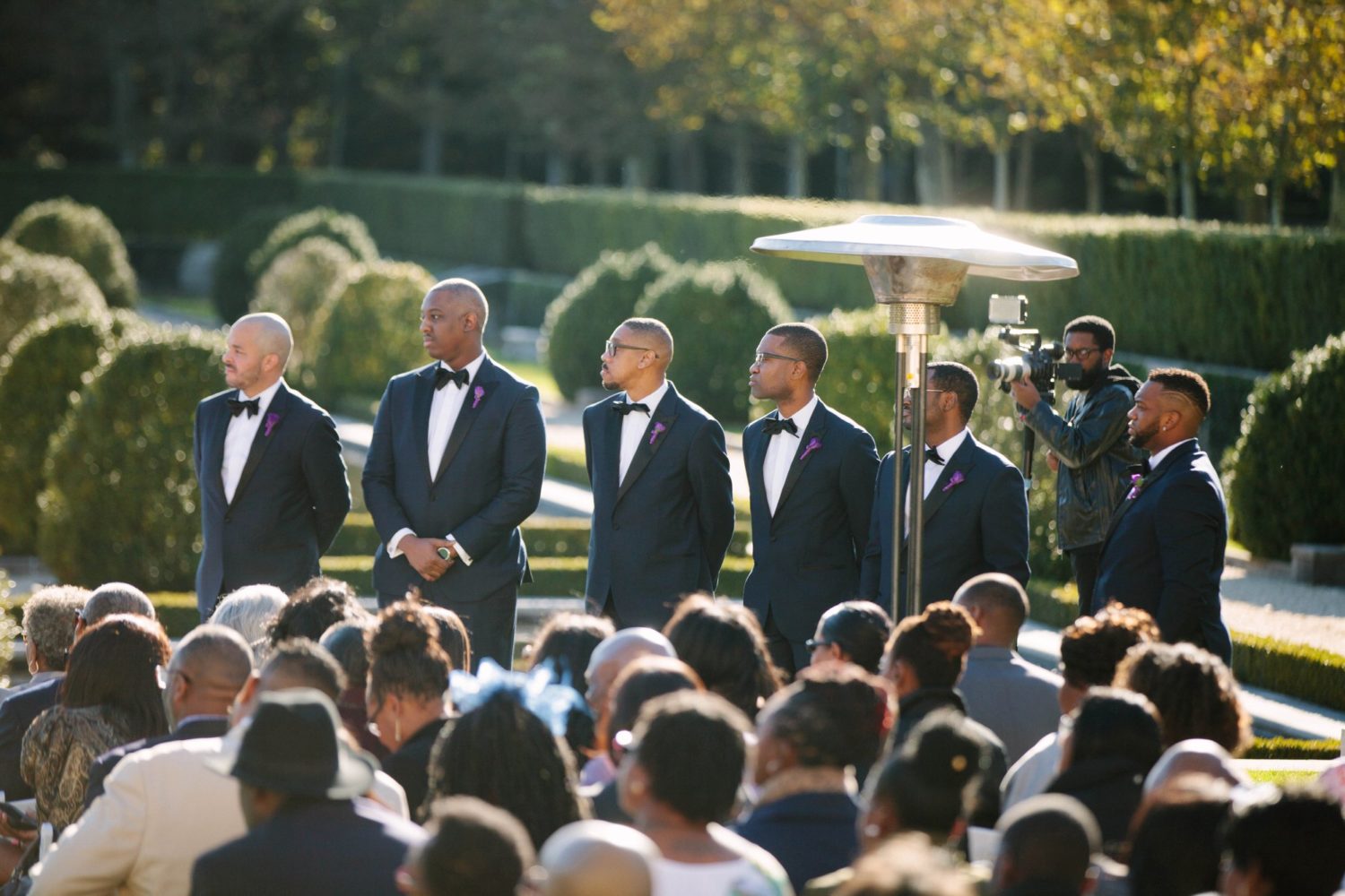Wedding ceremony photography, groomsmen in ceremony at Oheka Castle.