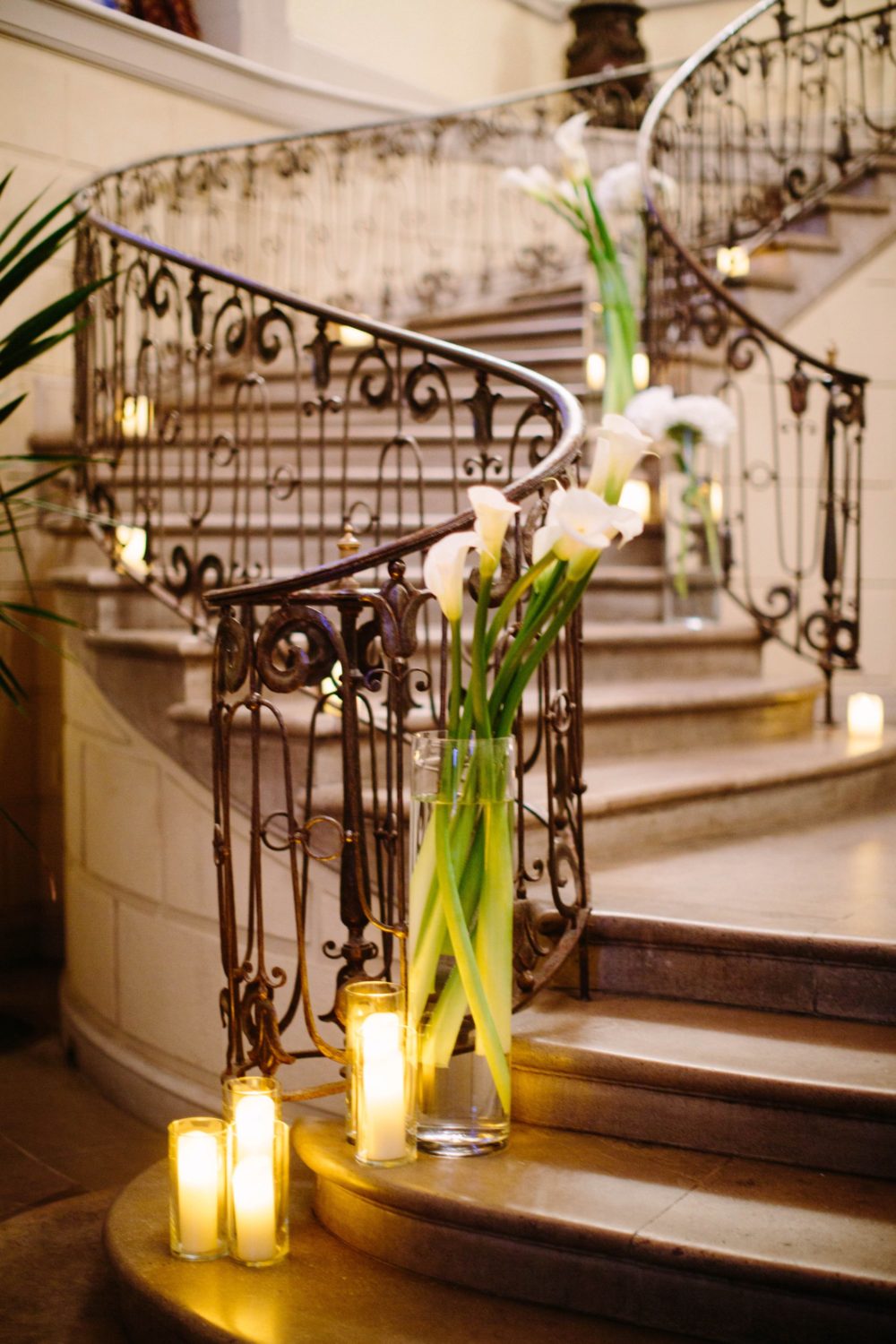 Calla Lilies and candles on stairs, New York wedding photography.
