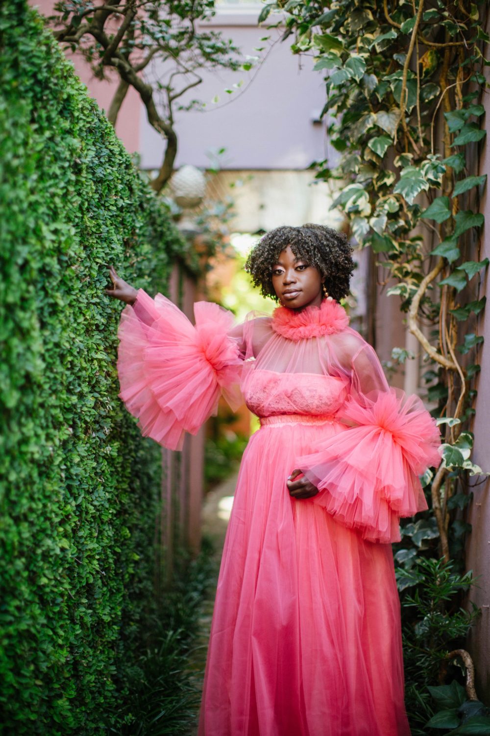 Tulle dress in coral with bell sleeves in Fashion photo shoot in Charleston SC