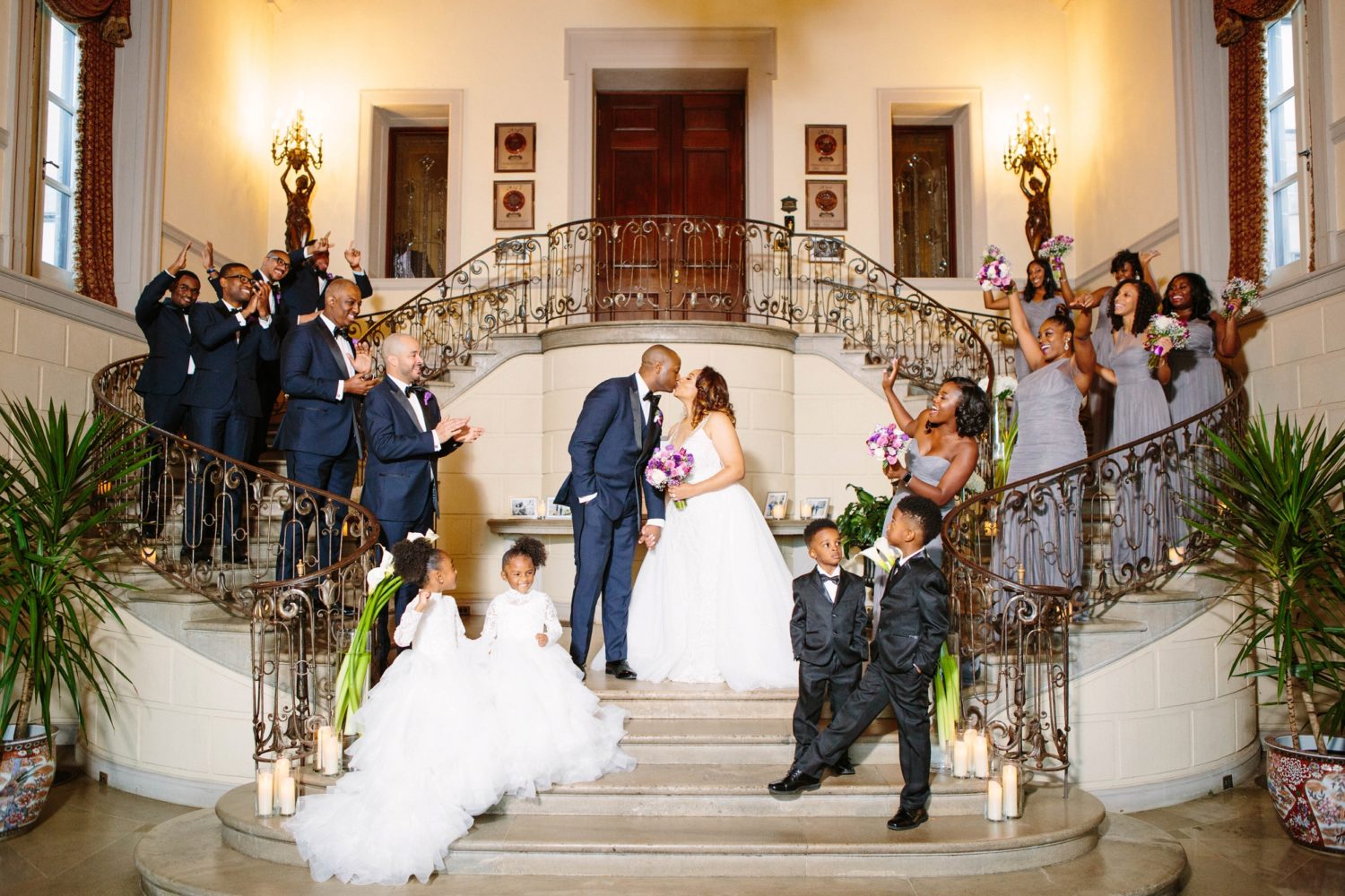 Large Bridal Party wedding photo inside the Oheka Castle in Huntington, New York | Photo by Samantha Clarke