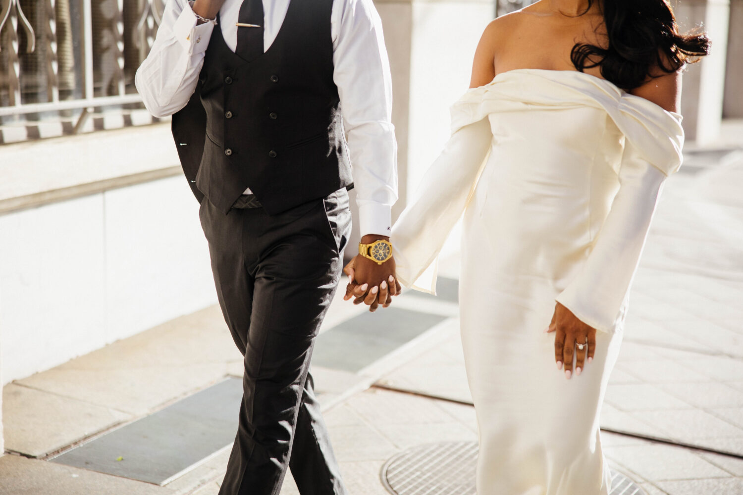 Couple is holding hands while engaged for their photo shoot in Alanta