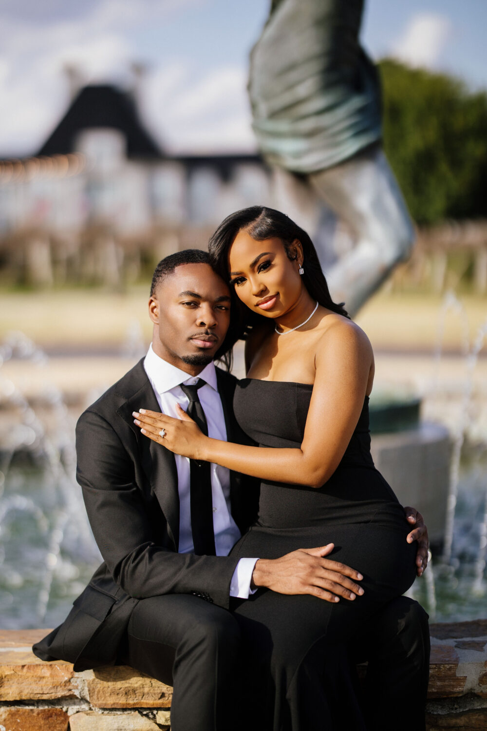 Engaged couple wearing all black in front of Chateau Elan in Georgia